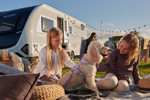 Family enjoying a trip in their Swift Sprite caravan